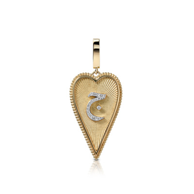 Gold heart-shaped pendant featuring a diamond-accented design in the center.