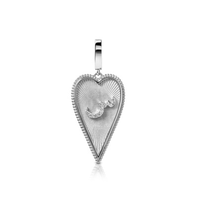 Silver heart-shaped pendant featuring a textured surface and decorative element.