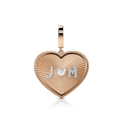 Large heart-shaped charm featuring diamond solitaire and initials J and M in a decorative design.