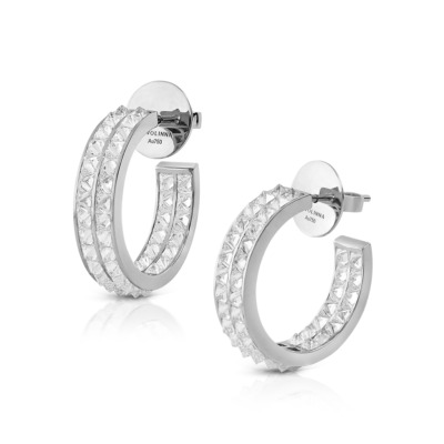 Silver hoop earrings with two rows of diamond-like stones arranged in a geometric pattern.