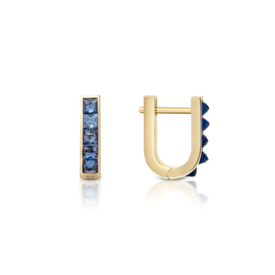 Gold mini huggie earrings featuring a single row of blue sapphires set in a vertical design.