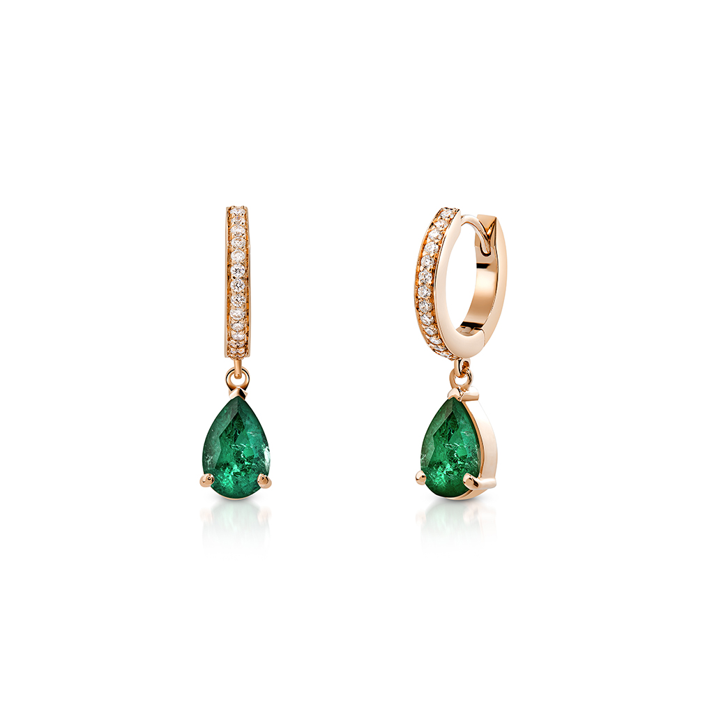 Emerald drop earrings featuring a pear-shaped emerald and diamond accents in a gold setting.
