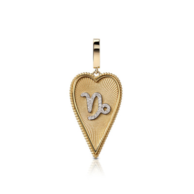 Elongated heart-shaped pendant featuring the Capricorn zodiac sign in gold and silver.