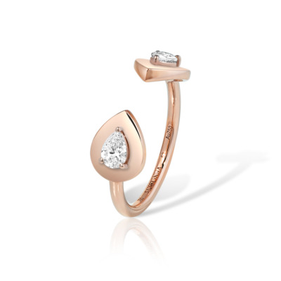 Double pear-shaped ring featuring two gemstones set in glossy rose gold.