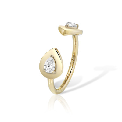 Double pear-shaped ring featuring two gemstones set in glossy yellow gold.