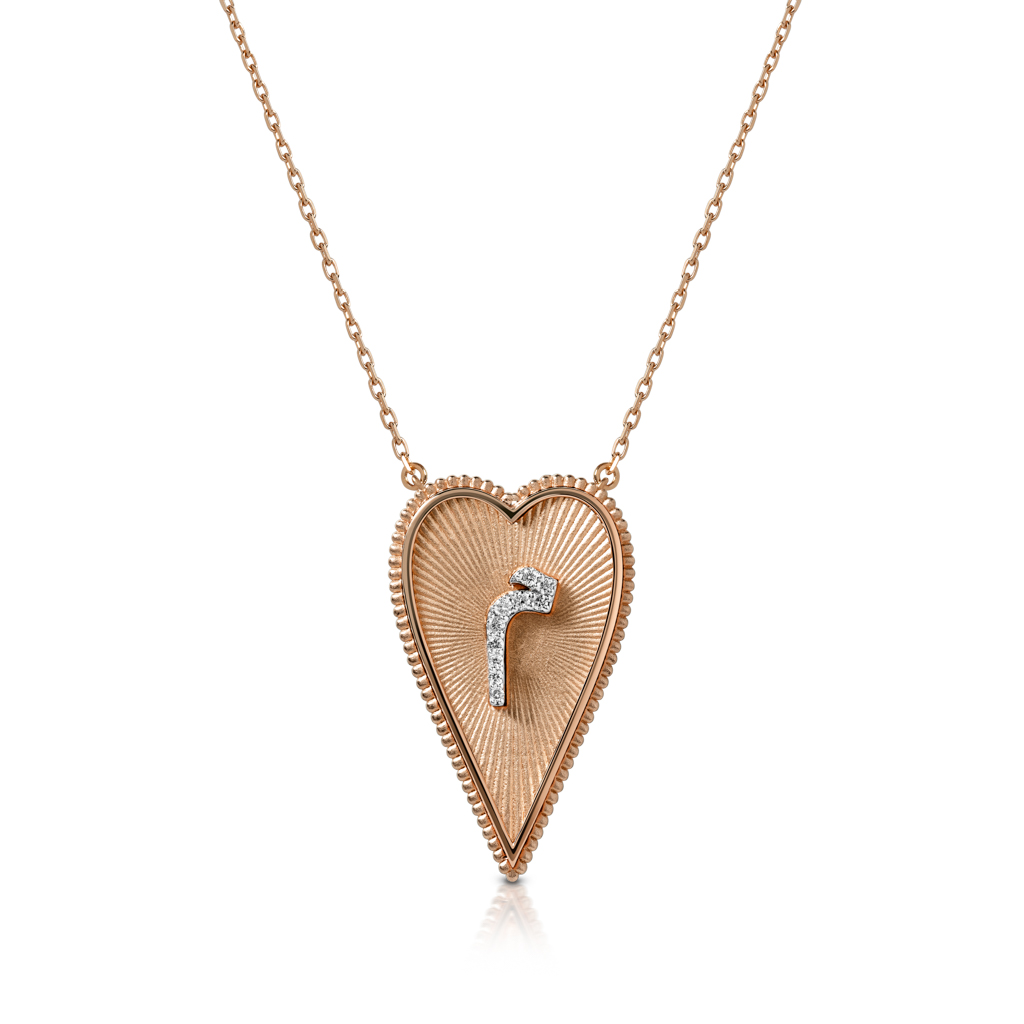 Rose gold heart-shaped pendant necklace featuring a diamond accent in the center.