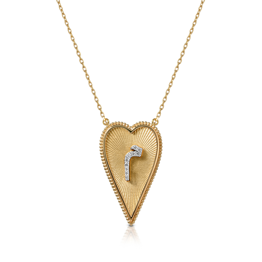 Gold heart-shaped pendant necklace featuring a diamond accent in the center.