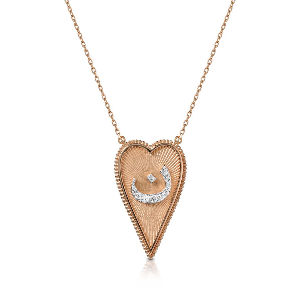 Gold heart-shaped pendant necklace featuring a diamond accent in a crescent shape.