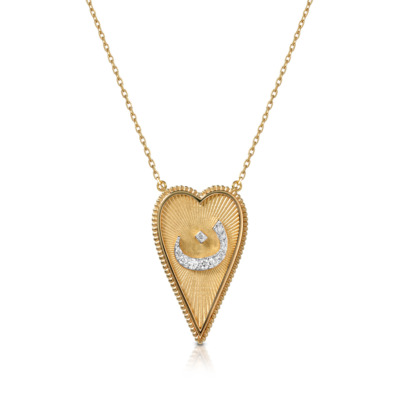 Gold heart-shaped pendant necklace featuring a diamond accent in a crescent shape.