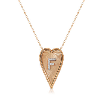 Elongated heart-shaped necklace featuring the letter F in diamonds on a rose gold chain.