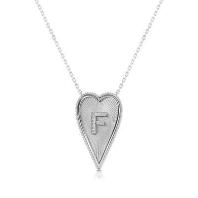 Elongated heart-shaped necklace featuring the letter F in a diamond-studded design on a white gold chain.