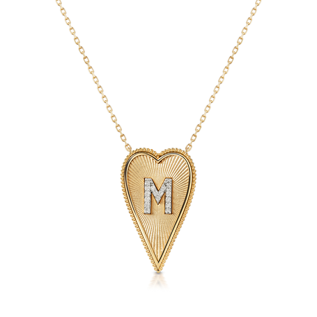 Gold elongated heart necklace featuring the letter M in a diamond-studded design.