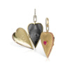 Elongated heart-shaped locket with ruby accents and a photo compartment featuring the Eiffel Tower.