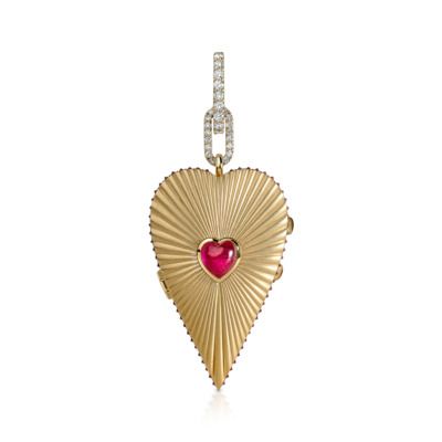 Elongated heart-shaped locket in gold with a ruby heart at the center and diamond accents.