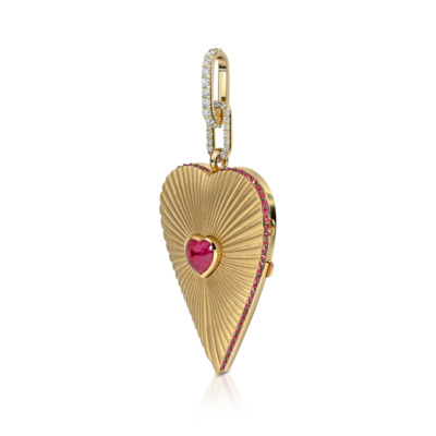 Gold elongated heart locket with ruby and diamond accents on a white background.