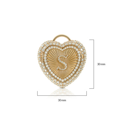 Gold heart charm featuring an engraved letter S and surrounded by small clear stones.