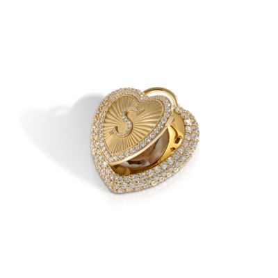 Gold heart-shaped love locket adorned with diamonds and a textured interior design.