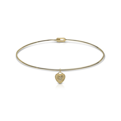 Yellow gold choker necklace with a fluted heart pendant hanging from a thin band.