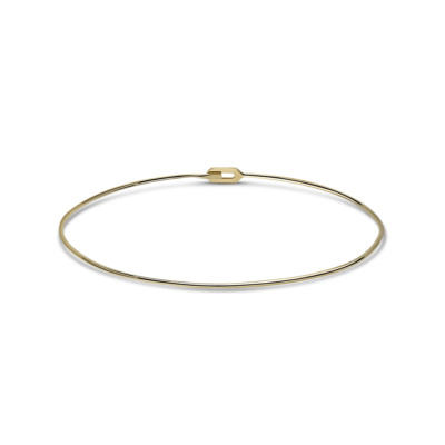Gold tube choker necklace with a simple and sleek design, featuring a secure clasp.