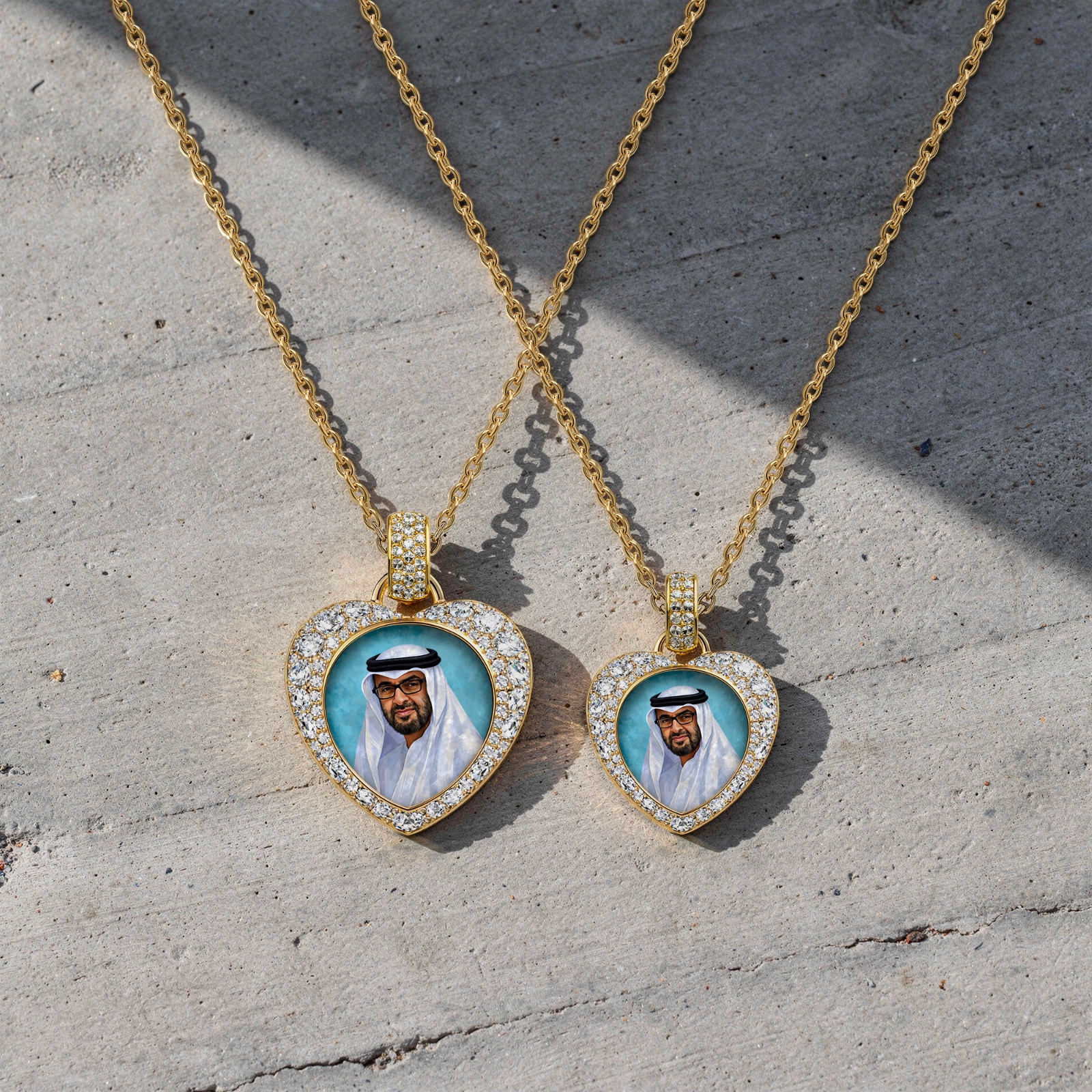 Gold heart-shaped pendant featuring a hand-painted portrait of Sheikh Mohamed bin Zayed Al Nahyan, surrounded by a halo of brilliant-cut diamonds on a gold chain